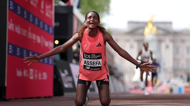 Tigst Assefa of Team Ethiopia celebrates crossing the line and winning with a new World Record time during the Women's 2026 TCS London Marathon on April 26, 2026 in London, England.