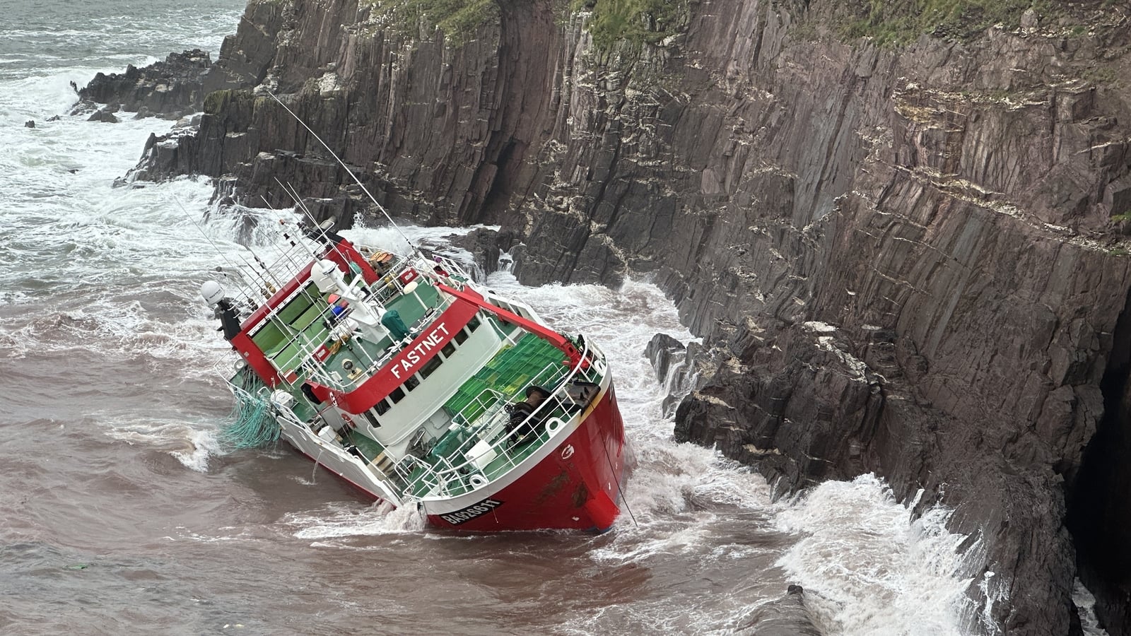 Operation to salvage trawler grounded 'in awkward spot'