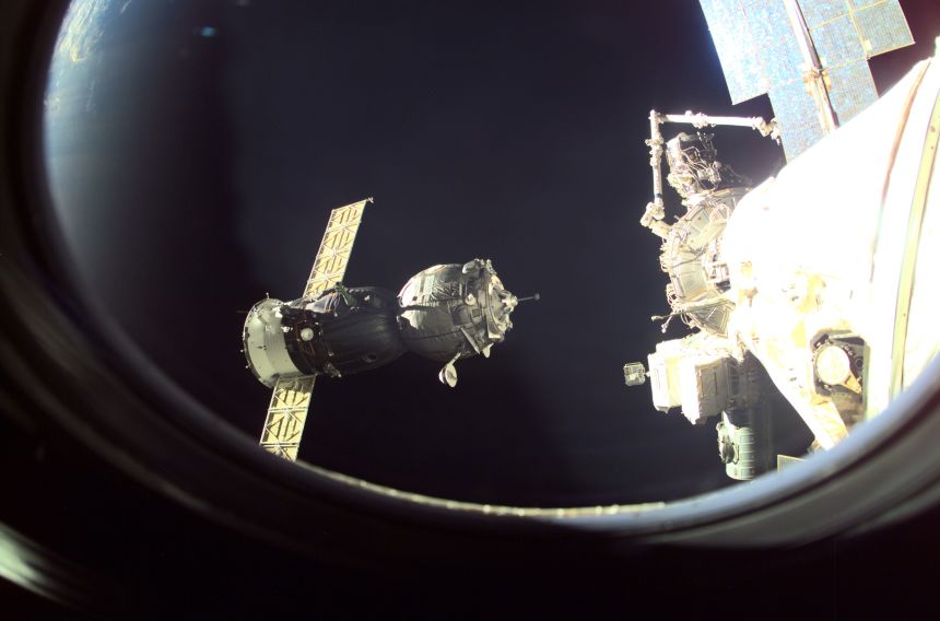 A Soyuz spacecraft approaches the International Space Station, carrying crew for an eight-day stay, as seen in October 2001.