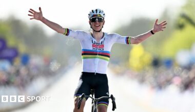 Tadej Pogacar holds his hands out wide as he celebrates winning the 2026 Tour of Flanders