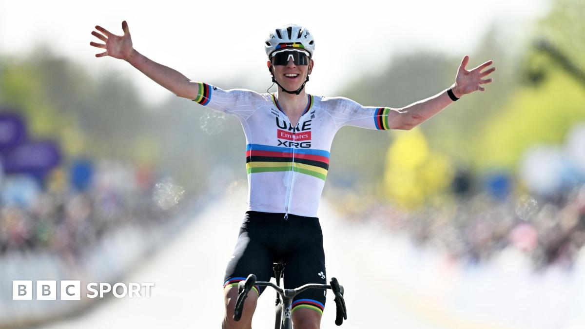 Tadej Pogacar holds his hands out wide as he celebrates winning the 2026 Tour of Flanders