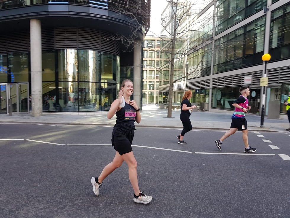 maia participating in a running event on a city street