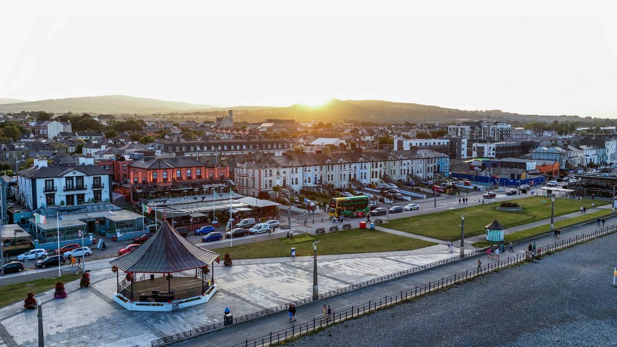 Bray town in County Wicklow, Ireland, during sunset, showing the seafront promenade