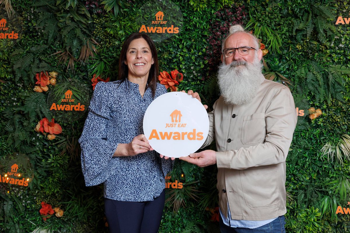 Amanda Roche-Kelly, Managing Director, Just Eat Ireland presenting the winner of ‘Independent Restaurant of the Year 2025’ to Raymond MacHugh, co-owner of Sano Pizza at the 12th annual Just Eat Awards