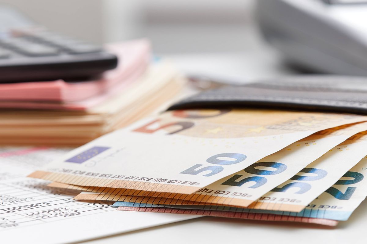 European Union currency with calculator, accounting concept, money, business, taxes, monthly expenses and personal finance, financial planner sheet