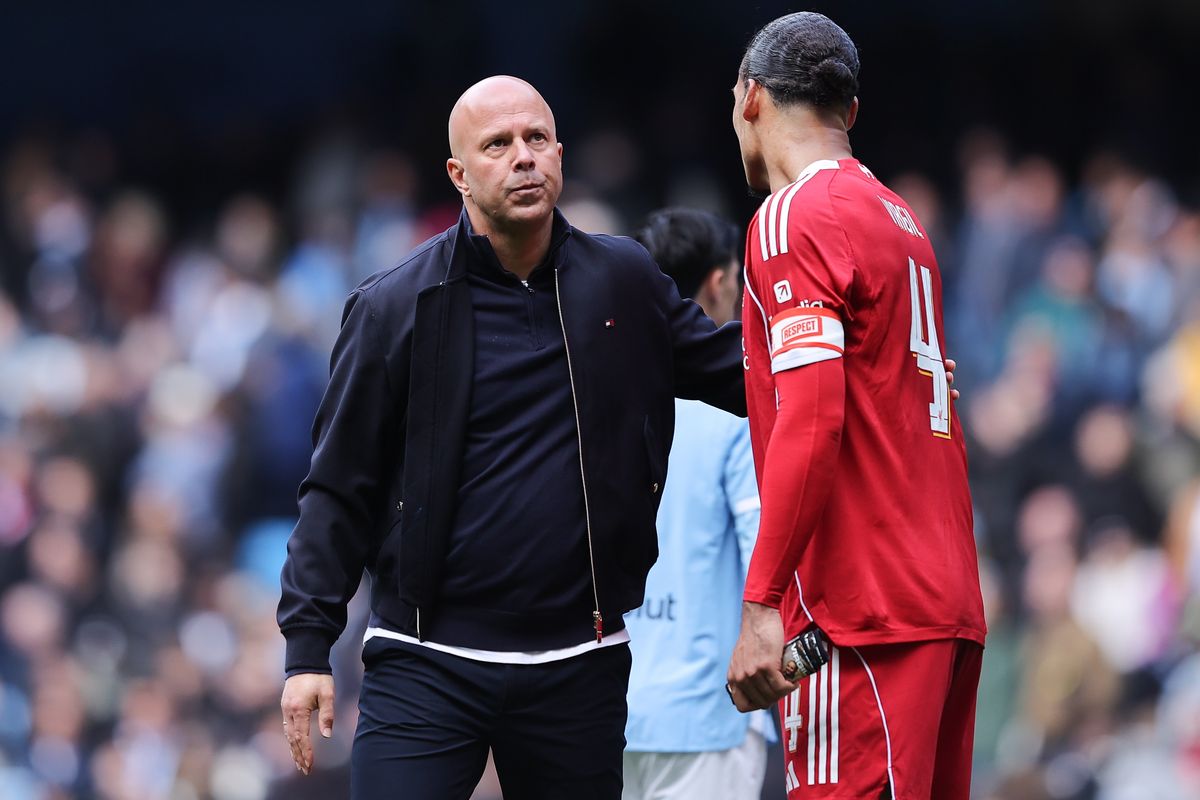 MANCHESTER, ENGLAND - APRIL 04: Arne Slot, head coach of Liverpool, acknowledges Virgil van Dijk of Liverpool after the Emirates FA Cup Quarter Final match between Manchester City and Liverpool on April 04, 2026 in Manchester, England. (Photo by James Gill - Danehouse/Getty Images)