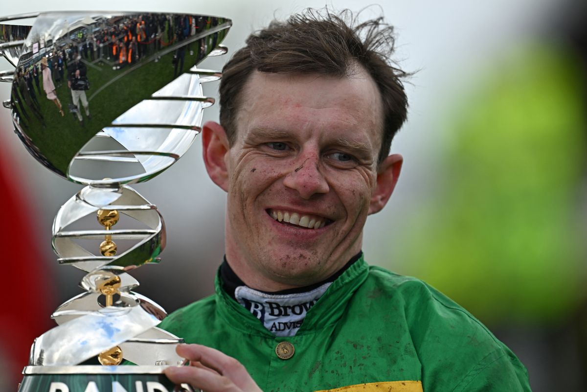 Paul Townend poses with the trophy after winning the Grand National