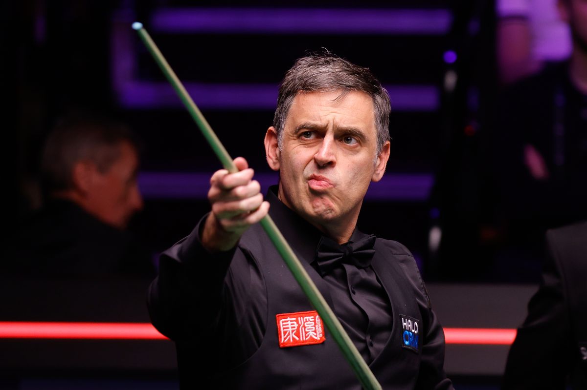 Ronnie O'Sullivan of England reacts in the first round match against He Guoqiang of China.