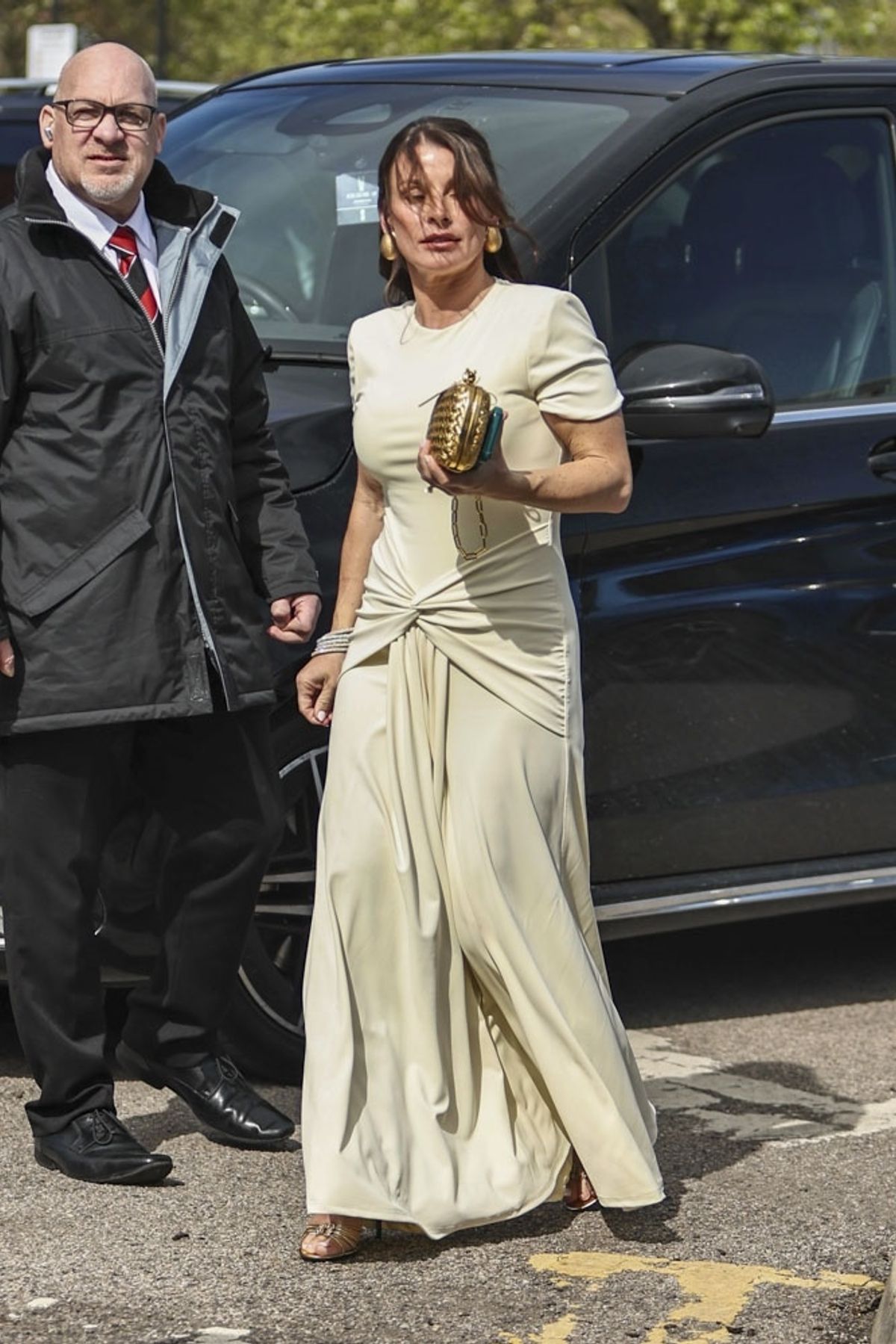 Coleen turned heads in a Roland Mouret butter yellow jersey draped waterfall maxi dress