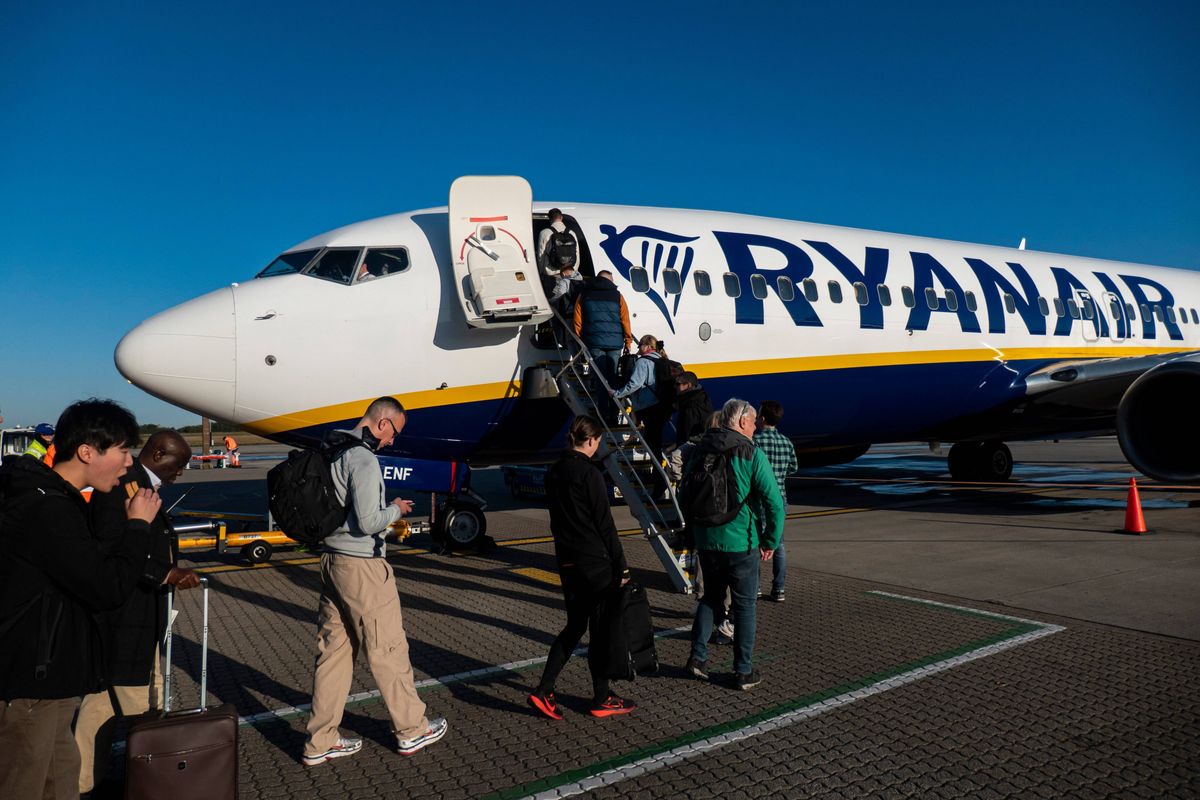 Passengers waiting in line and boarding a Ryanair low cost airline airplane at London Stansted Airport in the UK. The Boeing 737-800 passenger aircraft of the budget carrier has the registration tail number EI-ENF. Ryanair is an Irish Ultra Low-cost carrier group with headquarters in Dublin, Ireland with a fleet of 607 planes. Stansted Airport is the tertiary international airport serving London, the capital of England and the United Kingdom, fourth busiest in the UK owned by Manchester Airports Group. Stansted, United Kingdom on October 11, 2024 (Photo by Nicolas Economou/NurPhoto via Getty Images)