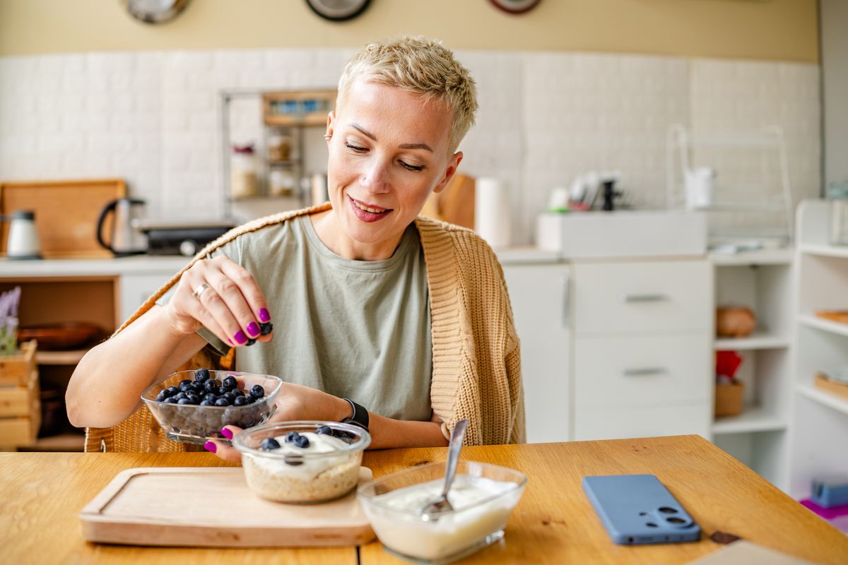 Person making breakfast oats