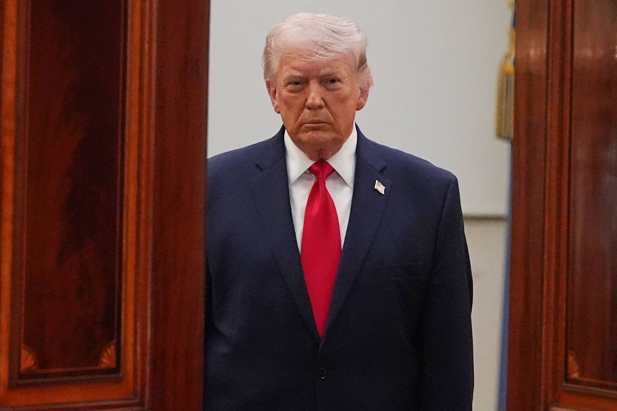 WASHINGTON, DC - APRIL 1: U.S. President Donald Trump arrives to speak in the Cross Hall of the White House on April 1, 2026 in Washington, DC. Trump used the prime-time address to update the nation on the war in Iran.  (Photo by Alex Brandon-Pool/Getty Images)