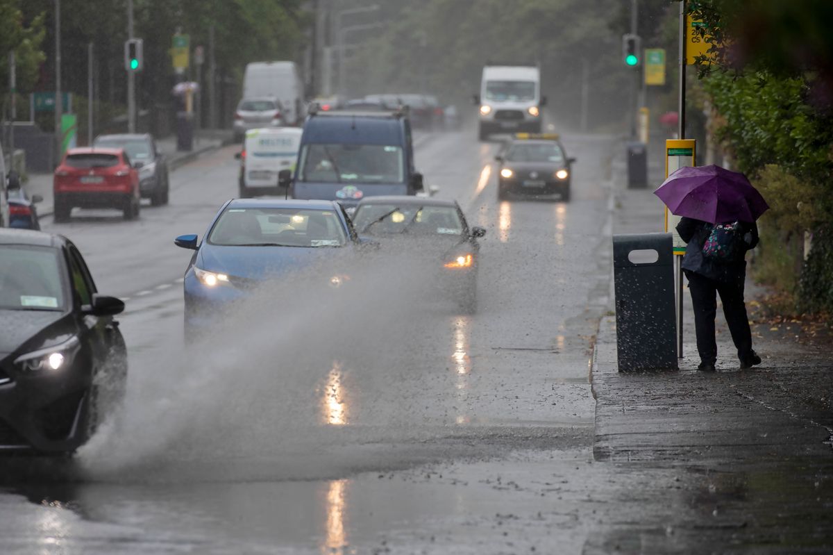 14/07/2023 - A vehicle drives  through a flood on Conyngham Road, Dublin