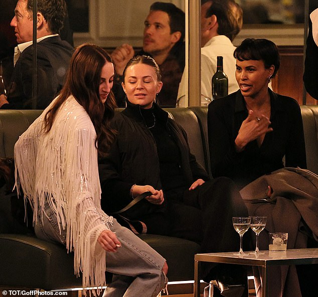 Sitting outside, Rosie looked gorgeous in a shimmering, fringed jacket and ripped jeans as she caught up with model and skincare brand founder Sabrina