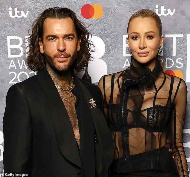 Attwood was spotted kissing her friend and fellow reality TV stalwart Pete Wicks earlier this year (pictured together at the BRIT Awards in 2025)