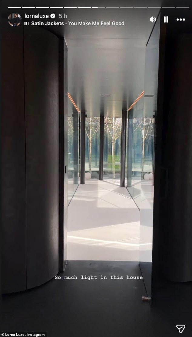 The influencer showed off the modern home with glass walls and chic furnishings as she settled in with beloved dog Kev-Bear