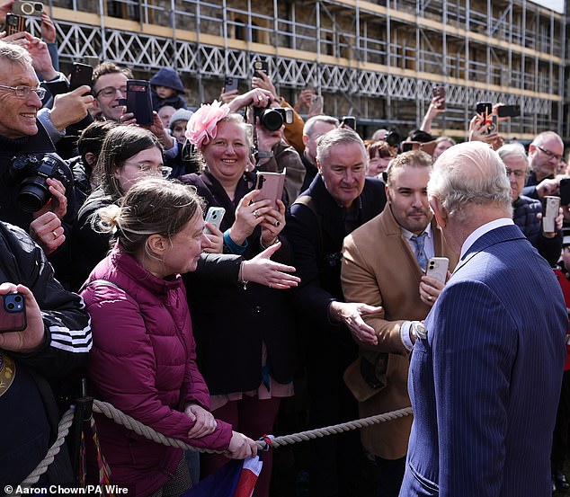 Charles and Camilla walked around in a a shortened meet-and-greet, cheered by the public waiting patiently outside the chapel, following the service