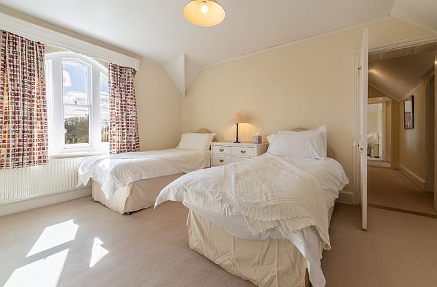 The description says the property includes 'everything you need for a comfortable, independent break', including WiFi, private gated parking, and 'a fully equipped kitchen featuring a dishwasher, microwave, and coffee machine, laundry facilities, and a hairdryer'