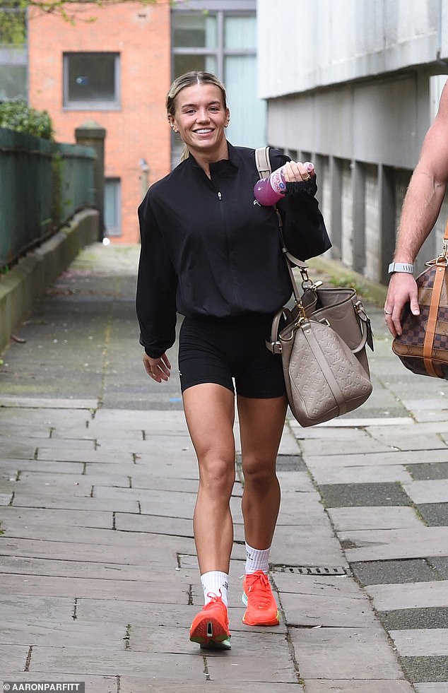 For the workout session, Molly, 31, cut a sporty figure in a black zip-up jacket and form-fitting shorts, which showcased her toned legs, as she smiled for the cameras while leaving the gym