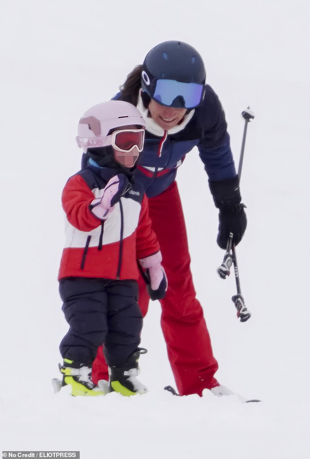 Pippa can be seen supportively urging on her daughter Rose, three - with an encouraging word as well as her her ski poles