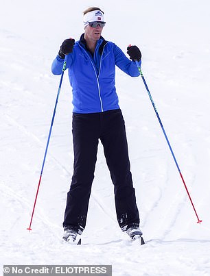James, 50, in blue trousers and jacket with a red and white stripe, helmet and aviator sunglasses, skied on solo ahead