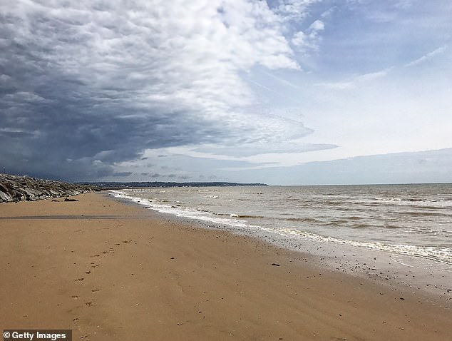 Cloudy skies and 'poor' water are on display at Dymchurch, Kent
