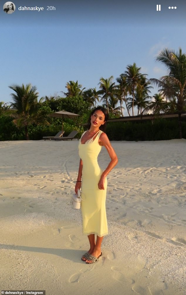 She also shared this pretty picture of herself walking along the beach in a yellow dress