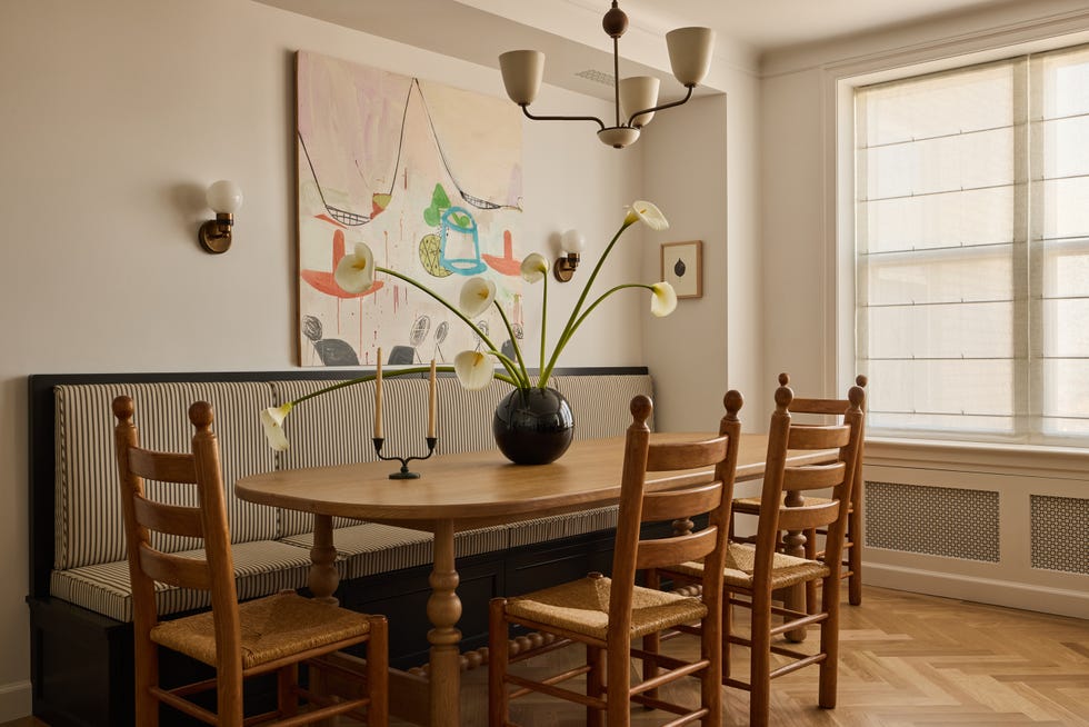 Dining area featuring a table, chairs, and decorative elements.