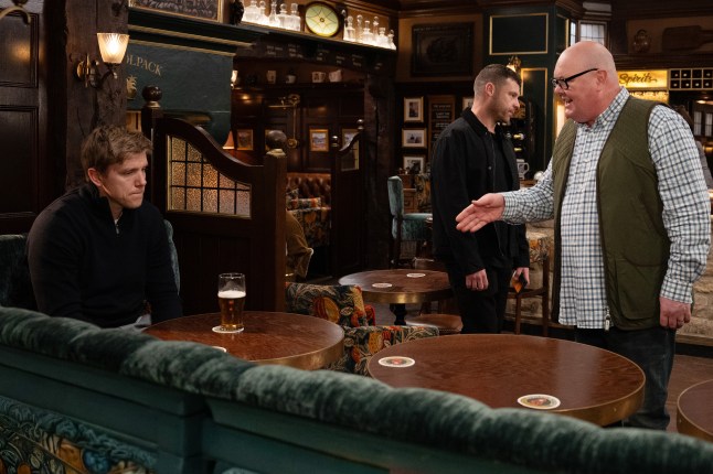 Robert Sugden sitting in the Woolpack while Paddy Kirk stand over him angrily