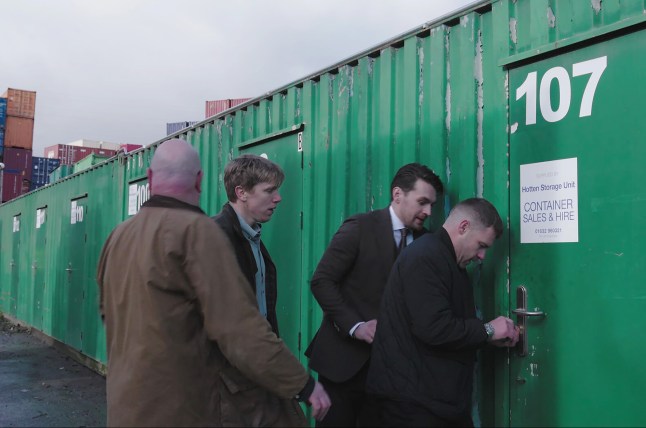 Robert, Aaron, Mack and Paddy outside a storage unit in Emmerdale