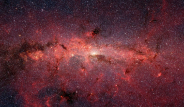 the band of the Milky Way galaxy shown in red light stretches across the sky