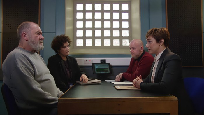 15_04_emm_bear_01 DS Walsh and a colleague sit opposite Bear Wolf and his solicitor in a police interview room in a scene from Emmerdale