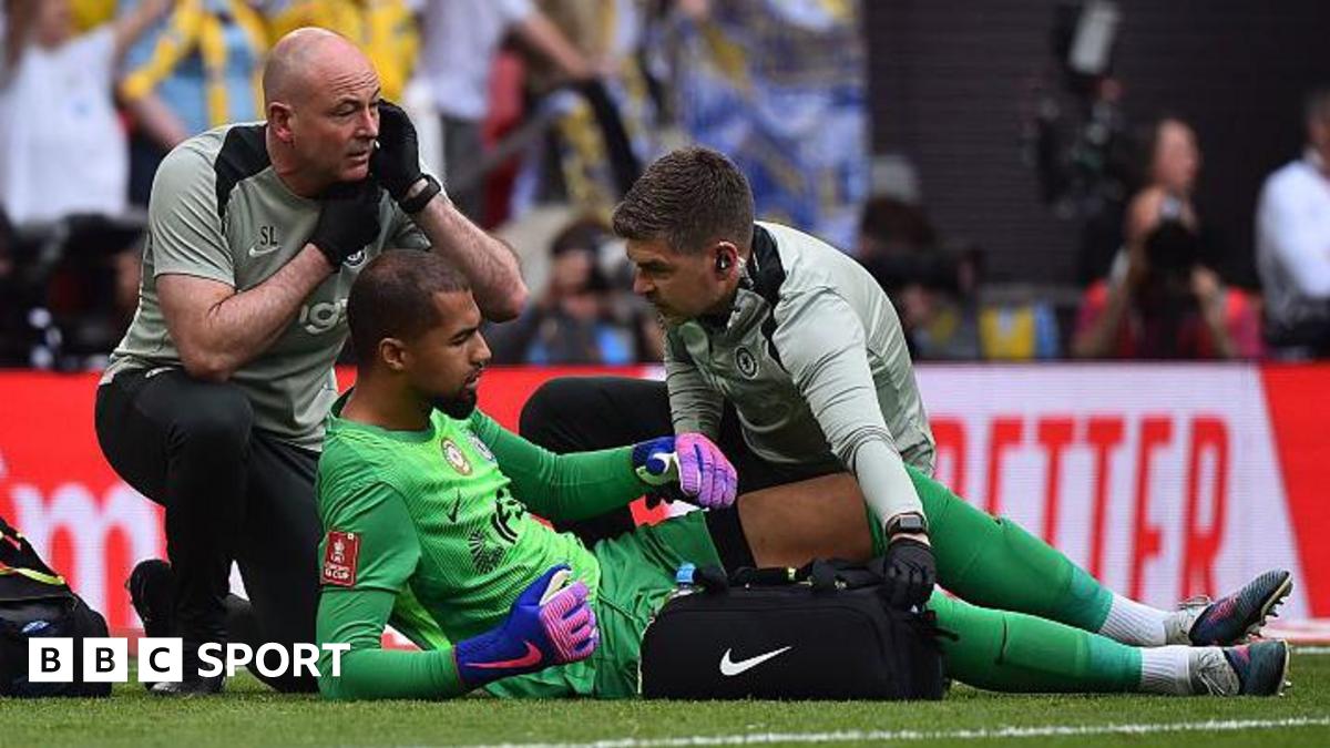 Robert Sanchez receives treatment for an apparent injury during the FA Cup semi-final between Chelsea and Leeds United at Wembley Stadium