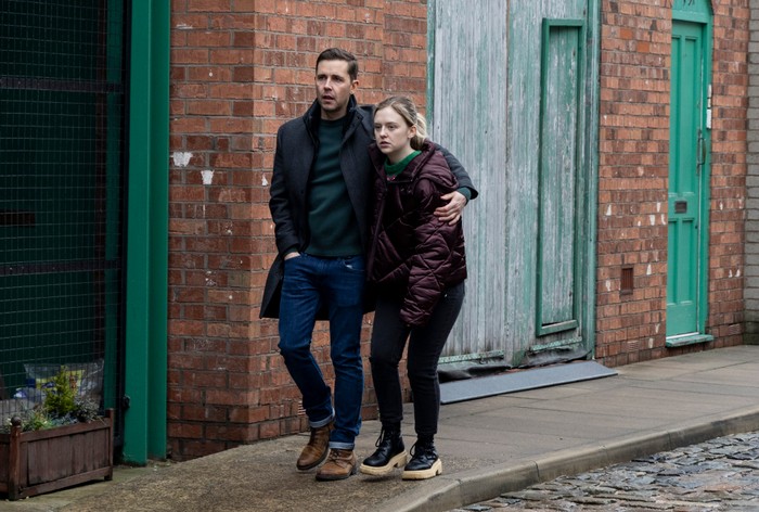 16_01_coro_todd_summer_01 Todd wraps his arm around a distraught Summer outside of the builder's yard in a scene from Coronation Street