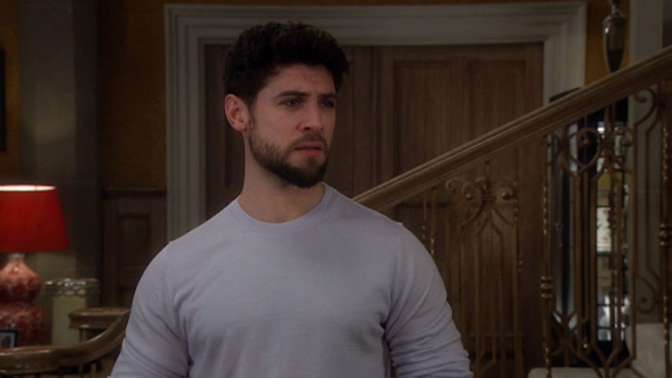 person standing indoors near a staircase