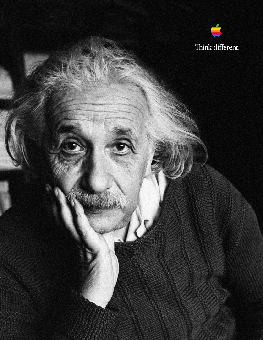 This photo shows an example of Apple's 1997 "Think Different" ad campaign. The ad shows a black-and-white portrait of Albert Einstein, and in the top-right corner in small letters is the slogan "Think different," along with the multicolor-striped Apple logo.