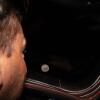 Astronaut Reid Wiseman looks out one of the Orion spacecraft's windows at the moon ahead of the crew's lunar flyby.