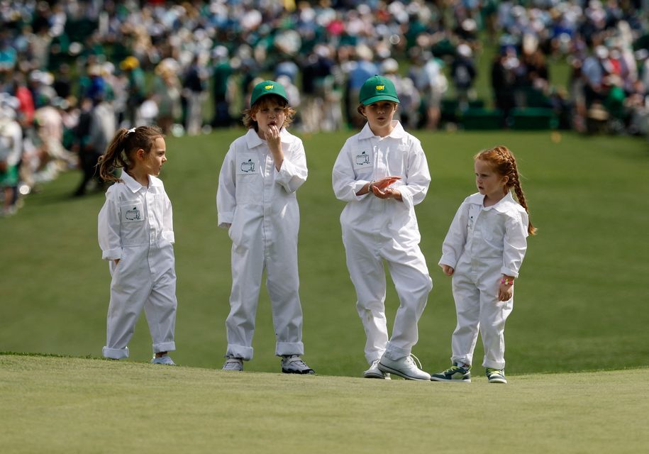 Poppy McIlroy, Frankie Fleetwood, Iris Lowry and Ivy Lowry on the second hole during the Masters par 3 contest at Augusta National Golf Club, Augusta, Georgia. Photo: Reuters/Brian Snyder