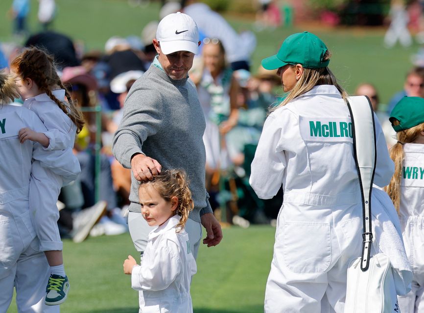 Golf - The Masters - Augusta National Golf Club, Augusta, Georgia, U.S. - April 8, 2026
Northern Ireland's Rory McIlroy with his wife Erica Stoll and daughter Poppy on the 6th hole during the par 3 contest REUTERS/Mike Blake