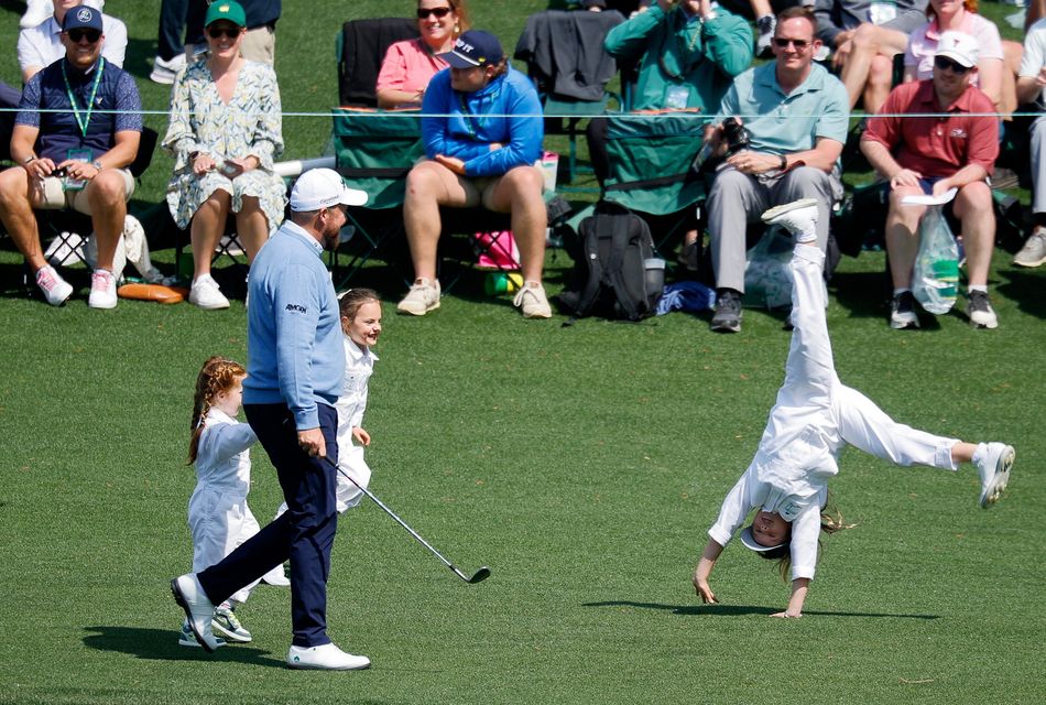 Golf - The Masters - Augusta National Golf Club, Augusta, Georgia, U.S. - April 8, 2026
Ireland's Shane Lowry with his daughters Iris and Ivy and Northern Ireland's Rory McIlroy's daughter Poppy on the 5th hole during the par 3 contest REUTERS/Mike Blake