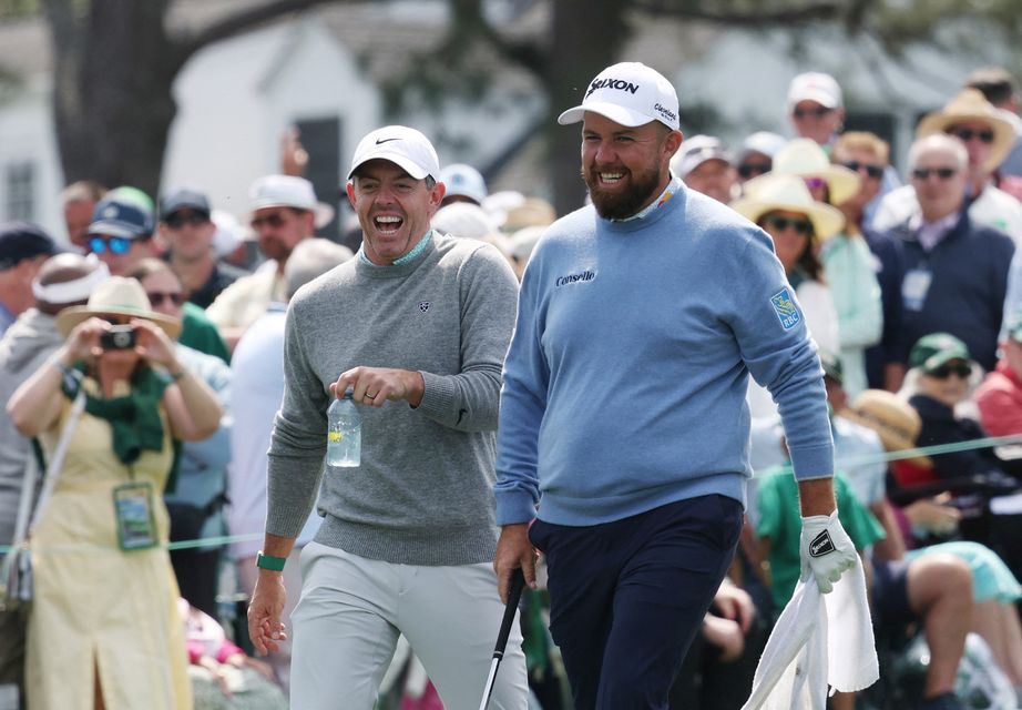 Golf - The Masters - Augusta National Golf Club, Augusta, Georgia, U.S. - April 8, 2026
Northern Ireland's Rory McIlroy with Ireland's Shane Lowry on the 1st hole during the par 3 contest REUTERS/Mike Segar