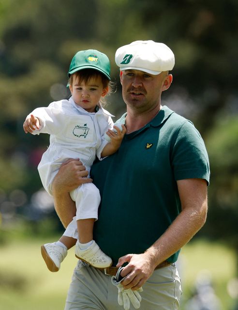 Golf - The Masters - Augusta National Golf Club, Augusta, Georgia, U.S. - April 8, 2026
England's Harry Hall with his daughter Lilah Hall on the 2nd hole during the par 3 contest REUTERS/Brian Snyder