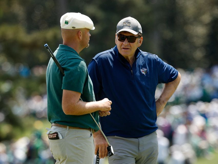 Golf - The Masters - Augusta National Golf Club, Augusta, Georgia, U.S. - April 8, 2026
England's Harry Hall with former golfer Nick Faldo on the 2nd hole during the par 3 contest REUTERS/Brian Snyder