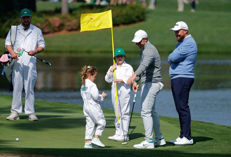 Golf - The Masters - Augusta National Golf Club, Augusta, Georgia, U.S. - April 8, 2026
Northern Ireland's Rory McIlroy with his daughter Poppy and Ireland's Shane Lowry during the par 3 contest REUTERS/Mike Blake