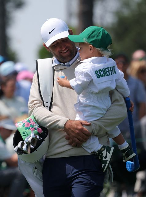 Golf - The Masters - Augusta National Golf Club, Augusta, Georgia, U.S. - April 8, 2026
Scottie Scheffler of the U.S. with his son Bennett Scheffler during the par 3 contest REUTERS/Mike Segar