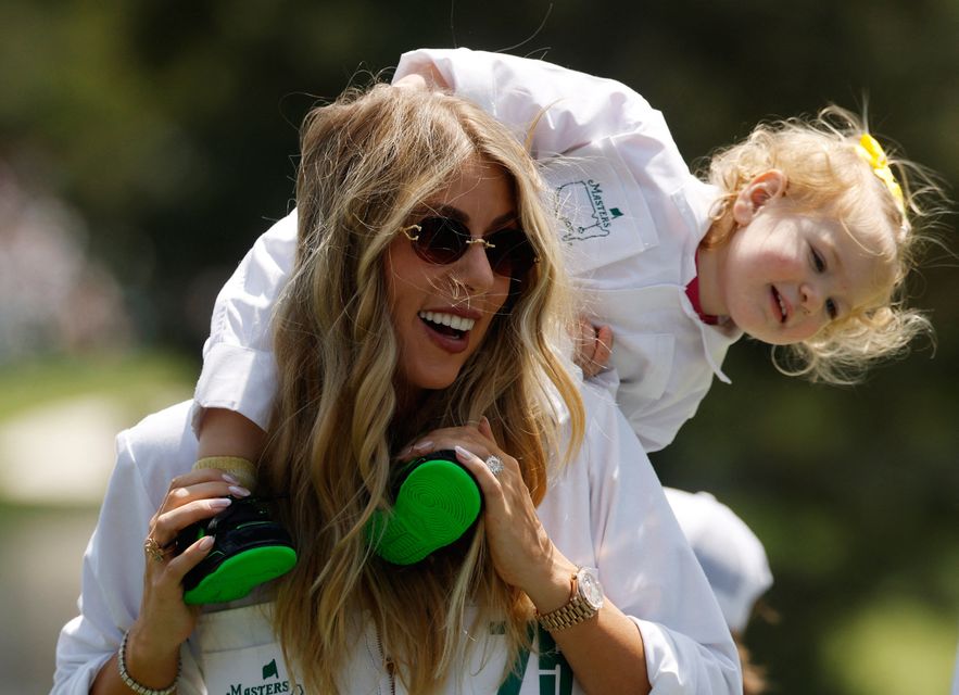 Golf - The Masters - Augusta National Golf Club, Augusta, Georgia, U.S. - April 8, 2026
Wife of Spain's Jon Rahm, Kelley Cahill with their daughter Alaia Rahm during the par 3 contest REUTERS/Brian Snyder