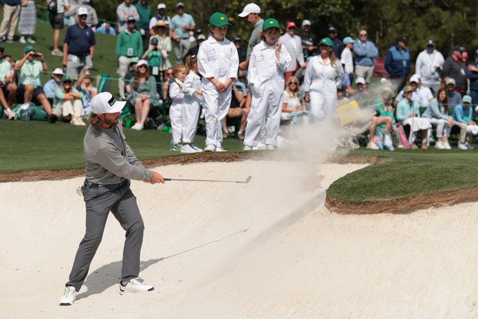 Golf - The Masters - Augusta National Golf Club, Augusta, Georgia, U.S. - April 8, 2026
England's Tommy Fleetwood plays out from the bunker on the 3rd hole during the par 3 contest REUTERS/Kylie Cooper