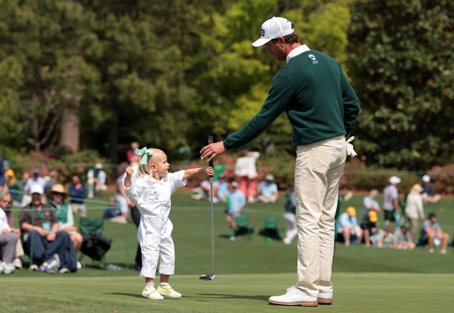 Golf - The Masters - Augusta National Golf Club, Augusta, Georgia, U.S. - April 8, 2026
Harris English of the U.S. with his daughter Emilia on the 3rd hole during the par 3 contest REUTERS/Kylie Cooper