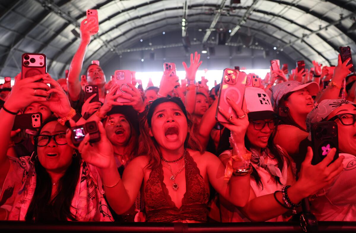 Fans scream as Bini performs on the Mojave stage at Coachella.