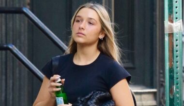 Harper Beckham steps out in a crop top and baggy jeans with the perfect accessory: Her signature off-duty style